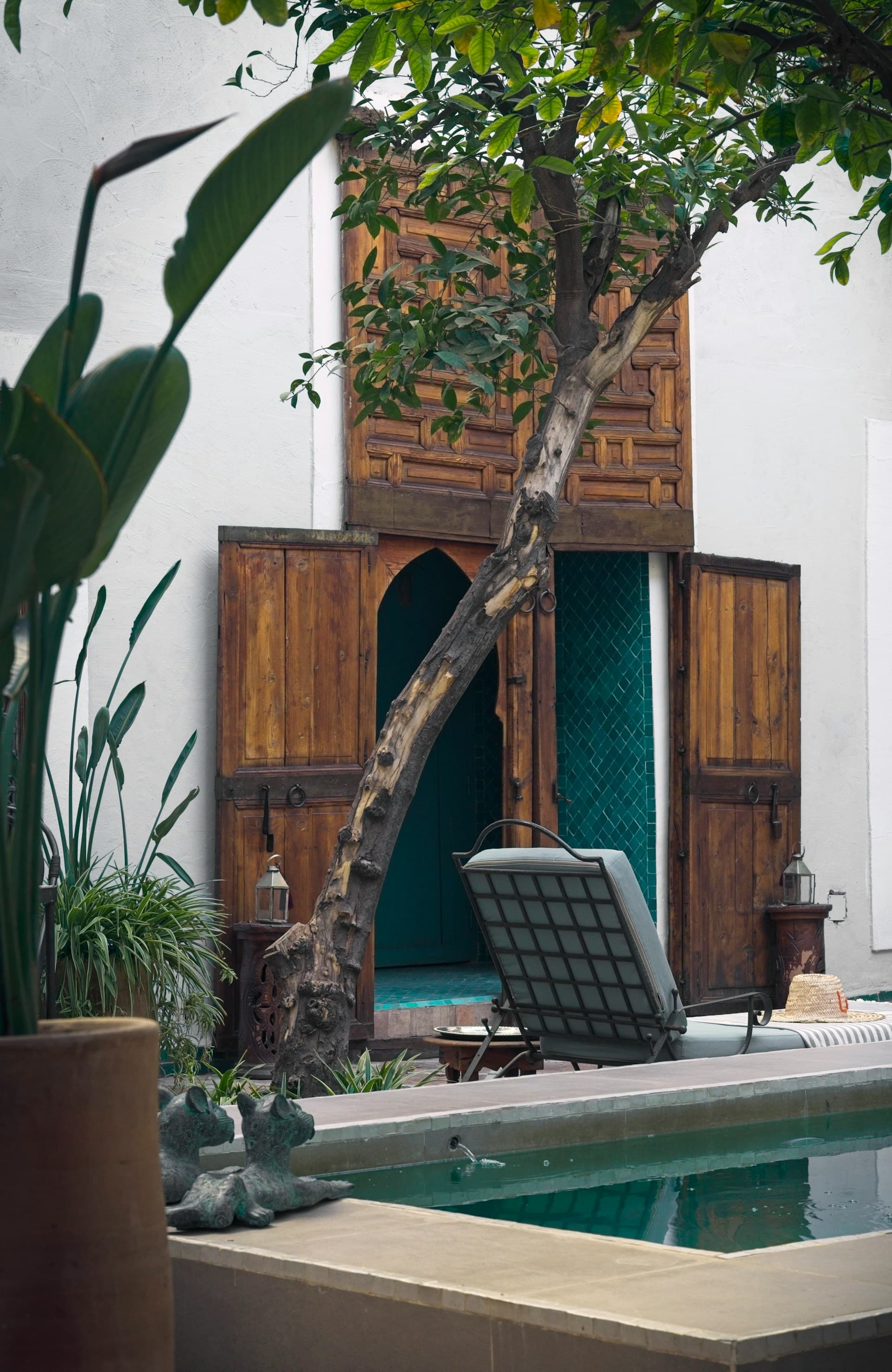 Moroccan riad courtyard — lanterns and plaster architecture